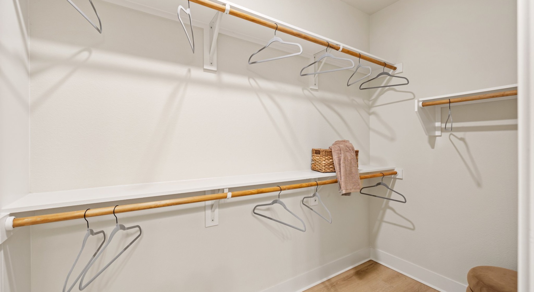 a walk-in closet with ample shelving